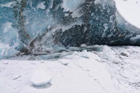 An ice cave on the Kuskulana Glacier, in the Wrangell Mountains. Winter snow and freezing temperatures ice up the water of the Kuskulana River, and the this wall of ice is a myriad of patterns, colors, and textures. Kuskulana Glacier, Wrangell-St. Elias National Park and Preserve, Alaska.